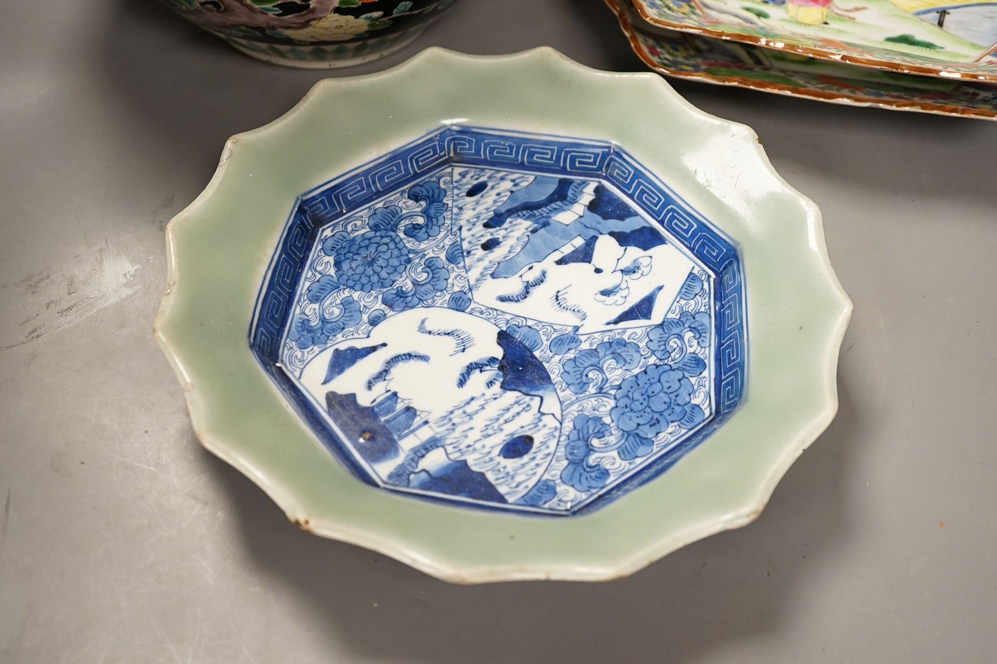 Three late 19th century Japanese porcelain dishes and a jardiniere, 19 cms high.